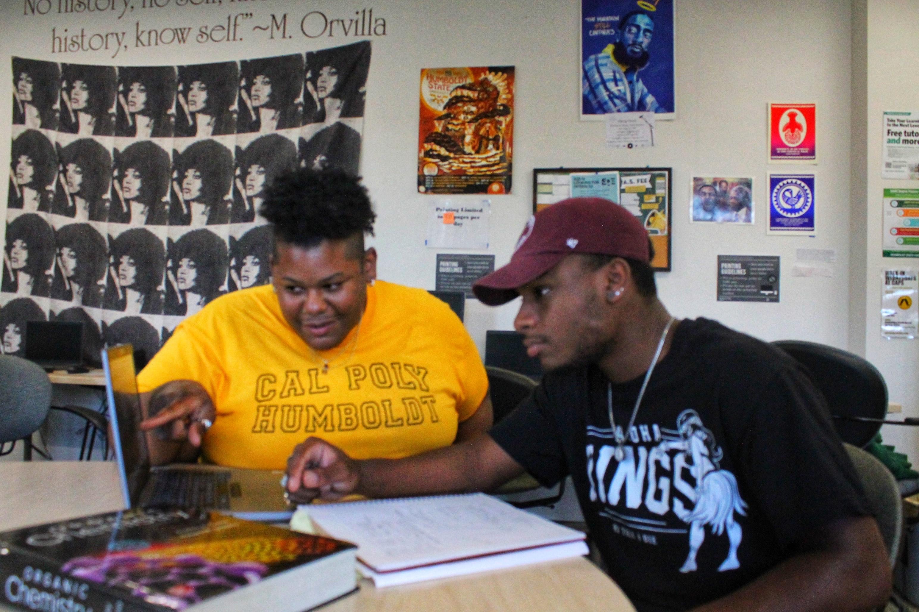 An academic advisor supports a student in the Umoja Center.